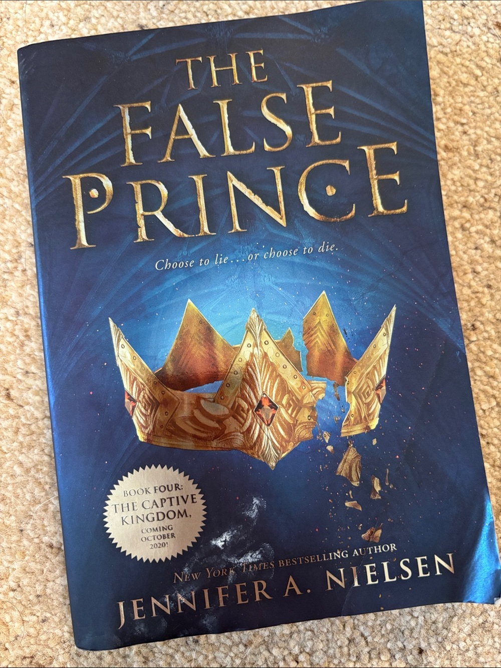 The False Prince by Jennifer A. Nielsen - Blue Cover with Gold Crown